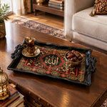 Black tray with gold trim featuring a calligraphy medallion in crimson floral scrollwork