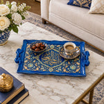 Royal blue tray with gold trim featuring a lobed Arabic calligraphy cartouche ringed by flowing floral vines