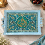 Turquoise tray with gold trim featuring a turquoise Arabic calligraphy medallion in a pointed arch with flowering vines