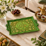 Green tray with gold trim featuring a lobed Arabic calligraphy medallion in dense floral scrollwork