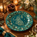 Teal charger plate with gold trim featuring Arabic calligraphy in a lantern and blossom ring