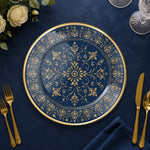 * Transparent glass charger plate with a sleek gold rim isolated on a clean background, showing its clear glass design.