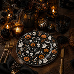 * White painting charger plates set on a wooden dining table paired with linen napkins for an elegant everyday dinner.