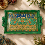 Emerald green tray with gold trim featuring calligraphy above a floral band on a green ground