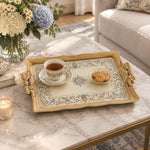 Warm cream tray with gold trim featuring a blue and gold baroque scroll border