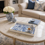 White tray with gold trim featuring blue and white porcelain floral and bird chinoiserie design