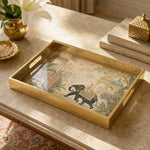Indian Palace Elephant Procession Decorative Tray with Mughal Architecture and Gold Frame | Minti Home on a coffee table, featuring UV-printed artwork on tempered glass with an electroplated frame and matching handles.