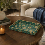 Teal Daisy Floral Plastic Serving Tray – Gold Leaf Accents styled on a coffee table with books, a candle, and decorative accessories.
