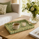 Olive Mini Daisy Floral Plastic Serving Tray – Gold Border styled on a coffee table with books, a candle, and decorative accessories.