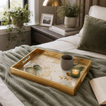 Sage Botanical Cream Gold Decorative Tray with Abstract Leaves and Gold Frame | Minti Home styled on a console table with a ceramic mug and books beside a brass lamp.