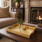 Mandala Glass Serving Tray – Cream Gold Lace Pattern styled on a console table with a ceramic mug and books beside a brass lamp.