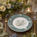 Powder-blue rim decorative charger plate with white peonies, forget-me-not florals, and a gold dotted border for French country tables.