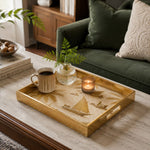 Gulf Coastline Glass Serving Tray – Palm Trees & Sailboats displayed on a dining table with a porcelain teapot and fresh flowers, vintage cabinet in background.