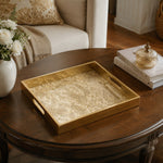 Vintage Gold Damask Arabesque Glass Serving Tray, 40x30cm displayed on a dining table with a porcelain teapot and fresh flowers, vintage cabinet in background.