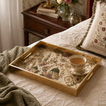 Islamic Mosque Embroidery Gold Decorative Tray with Green Domes and Gold Frame | Minti Home displayed on a dining table with a porcelain teapot and fresh flowers, vintage cabinet in background.