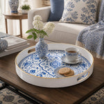 White tray with gold trim featuring blue and white Delft-inspired floral medallion pattern
