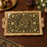 Black tray with gold trim featuring a gilded Arabic calligraphy medallion and floral vine border