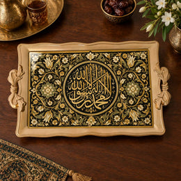 Black tray with gold trim featuring a gilded Arabic calligraphy medallion and floral vine border