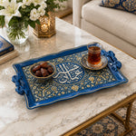 Royal blue tray with gold trim featuring a circular Arabic calligraphy medallion framed by dense floral arabesque scrollwork