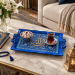 Cobalt blue tray with gold trim featuring a gilded Arabic calligraphy cartouche in a pointed arch amid flowering sprays