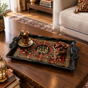 Black tray with gold trim featuring a calligraphy medallion in crimson floral scrollwork