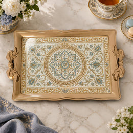 Champagne tray with gold trim featuring a scalloped rosette medallion and leafy floral vines