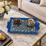Royal blue tray with gold trim featuring a lobed Arabic calligraphy cartouche ringed by flowing floral vines