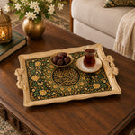 Black and beige tray with gold trim featuring an Arabic calligraphy medallion ringed by blooms and vines