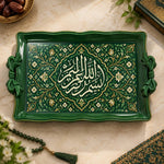 Emerald green tray with gold trim featuring a scalloped Arabic calligraphy medallion framed by leafy floral scrollwork