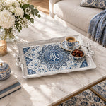 Silver white tray with gold trim featuring a calligraphy medallion in layered cobalt lotus petals