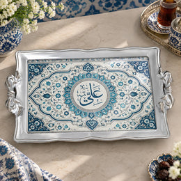 Slate and teal tray with gold trim featuring a calligraphy roundel in a lobed medallion frame