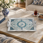 Slate and teal tray with gold trim featuring a calligraphy roundel in a lobed medallion frame