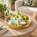 Ramadan & Eid al-Fitr Plastic Serving Tray – Golden Monstera Palm plastic serving tray shown in a round styled scene.