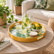 Ramadan & Eid al-Fitr Plastic Serving Tray – Golden Monstera Palm plastic serving tray shown in a round styled scene.