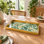 Ramadan & Eid al-Fitr Plastic Serving Tray – Golden Monstera Palm plastic serving tray shown in a rectangular styled scene.