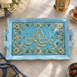 Light blue tray with gold trim featuring a wide band of Arabic calligraphy flanked by flowering vines and beads
