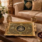 Black tray with gold trim featuring a round calligraphy medallion and geometric floral scrollwork
