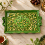 Green tray with gold trim featuring a lobed Arabic calligraphy medallion in dense floral scrollwork