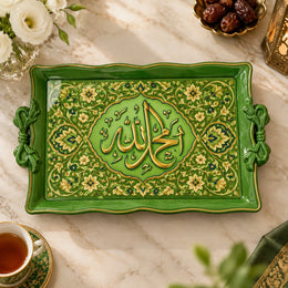 Green tray with gold trim featuring a lobed Arabic calligraphy medallion in dense floral scrollwork