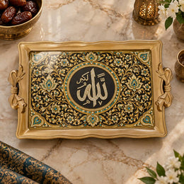 Black tray with gold trim featuring a round calligraphy medallion and geometric floral scrollwork
