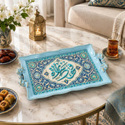Light blue tray with gold trim featuring a central Arabic calligraphy cartouche amid floral scrollwork and beading