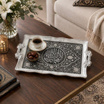 Silver and black tray with gold trim featuring a calligraphy medallion in a damask floral arch