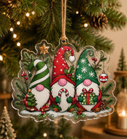 Clear acrylic hanging decor featuring three cute Christmas gnomes in red and green hats with candy canes.