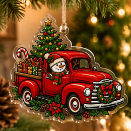 Clear acrylic hanging decor shaped like a vintage red truck carrying Christmas trees and gifts with Merry Christmas text.