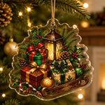 Clear acrylic hanging wall decor shaped like a stack of red, green, and gold Christmas gift boxes with holly.