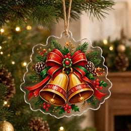 Irregular-shaped clear acrylic hanging decor featuring a glossy print of golden Christmas bells and a large red bow.