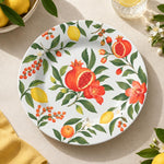 Daily Decorative Charger Plate – Pomegranate Orange decorative charger plate on a styled table.