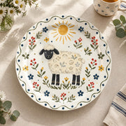Daily Decorative Charger Plate – Folk Sheep Sun Field decorative charger plate on a styled table.
