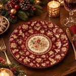 Burgundy charger plate with gold trim featuring a rose medallion and scattered fleur-de-lis sprigs