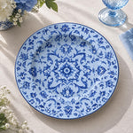 Pale blue charger plate featuring a tonal blue damask medallion and trailing floral sprigs
